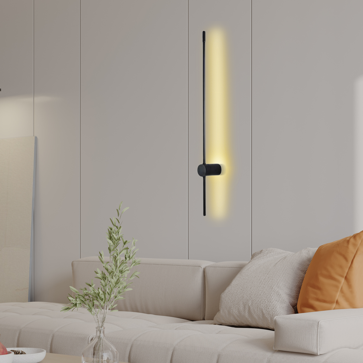 Wandleuchte im linearen Design als dezente Raumbeleuchtung neben einem Wandbild im Wohnzimmer